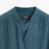 Fließende Bluse mit Überkreuzschnitt Fließende Bluse mit Überkreuzschnitt