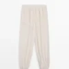 Fließende Sarouel-Hose mit Plissee-Detail Fließende Sarouel-Hose mit Plissee-Detail