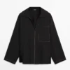 Fließendes Overshirt aus Wollmischung mit Taschendetails Fließendes Overshirt aus Wollmischung mit Taschendetails