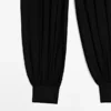 Halbtransparente Sarouel-Hose mit Knopfdetails Halbtransparente Sarouel-Hose mit Knopfdetails