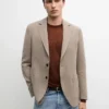 Maßgeschneiderter Leinen-Blazer mit Taschendetails Maßgeschneiderter Leinen-Blazer mit Taschendetails