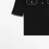 Poloshirt aus Baumwollstrick mit Kontrastdetails Poloshirt aus Baumwollstrick mit Kontrastdetails