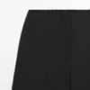 Weit geschnittene, verkürzte Stretch-Woll-Hose Weit geschnittene, verkürzte Stretch-Woll-Hose