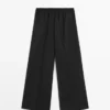 Weit geschnittene, verkürzte Stretch-Woll-Hose Weit geschnittene, verkürzte Stretch-Woll-Hose